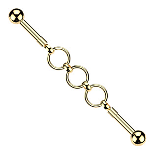 Zlacený industrial piercing s kroužky