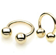 Zůatý piercing podkova